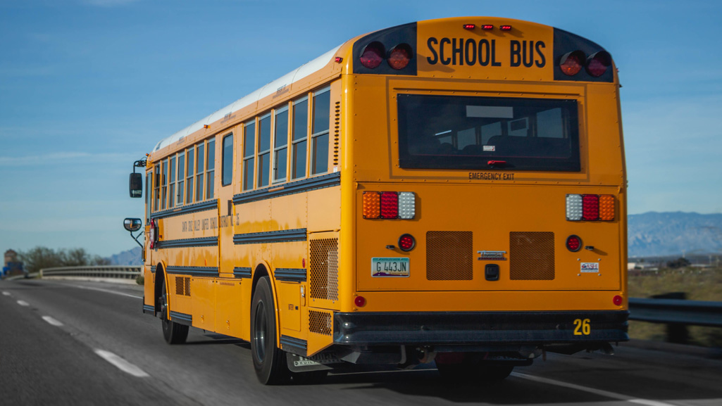 Yellow school bus driving