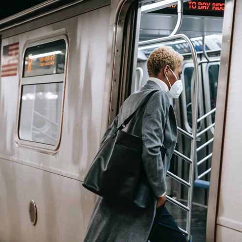 woman getting on a subway train