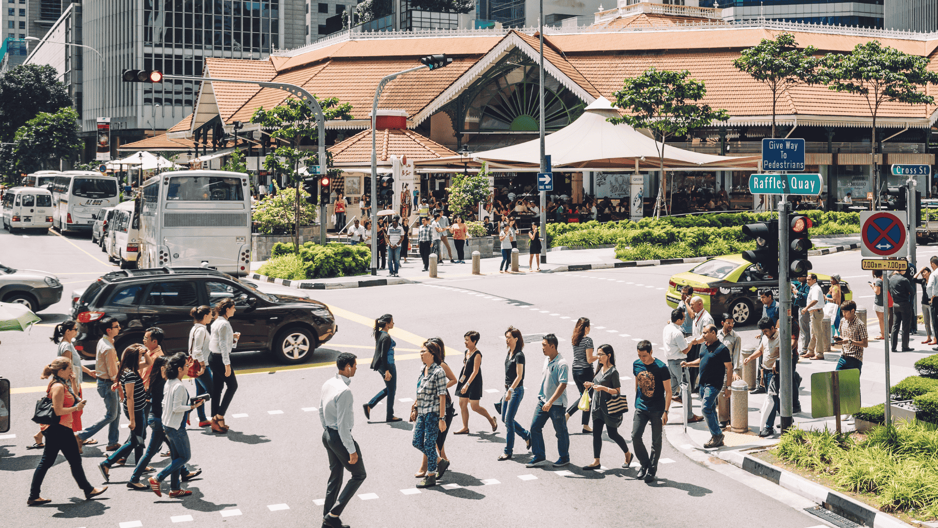 Pedestrians crossing street in Singapore, China