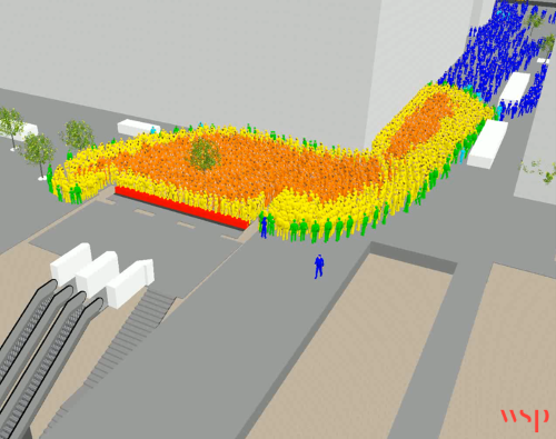Crowd queuing outside a metro entrance while doors are closed to protect platform capacity